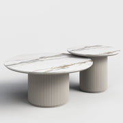 Bruil round white slate-top coffee tables with fluted bases