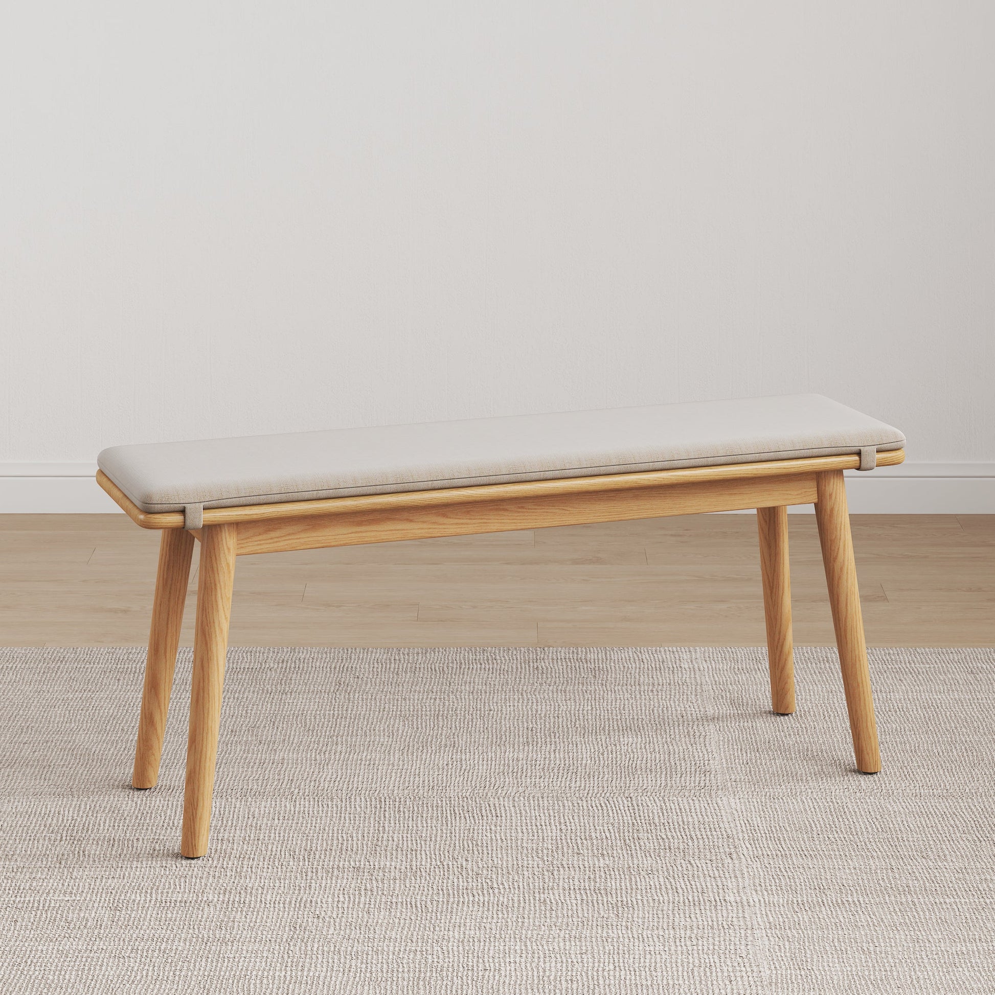 Legnano light wood dining bench with cream cushioned seat