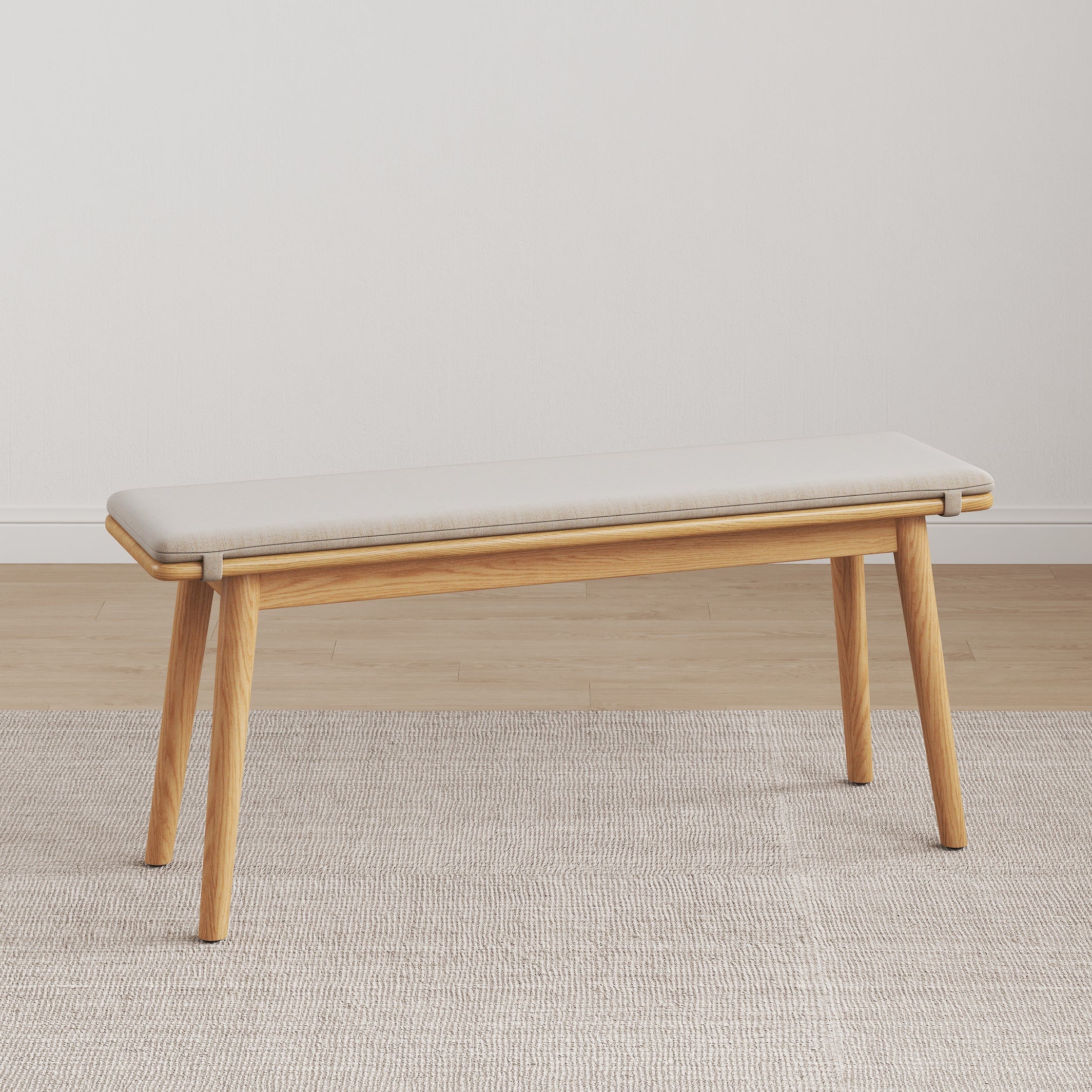 Legnano light wood dining bench with cream cushioned seat