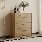 Platsa grey oak five drawer tallboy styled with plant and prints