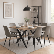 Bubbio grey PU leather dining chairs with black metal legs at a dining table