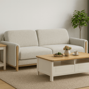 Stoven cream fabric sofa with exposed wood frame beside a coffee table