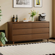 Arezzo six drawer chest in Claro Walnut styled against a panelled wall