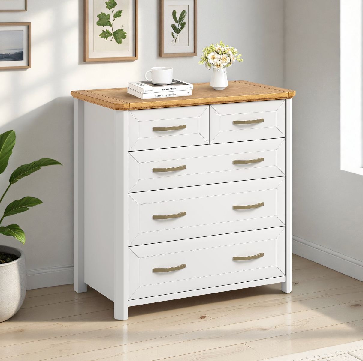 Stoven five drawer lowboy in white with wood top styled with a plant