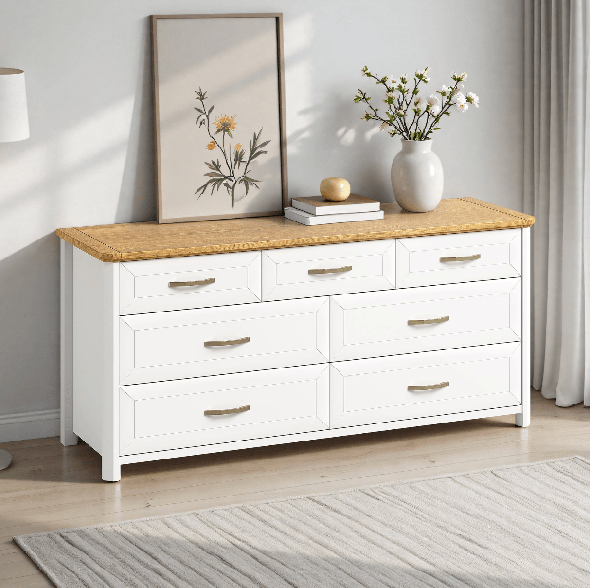 Stoven seven drawer chest in white and oak below a wall mirror