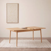 Legnano light wood extendable dining table in a dining room